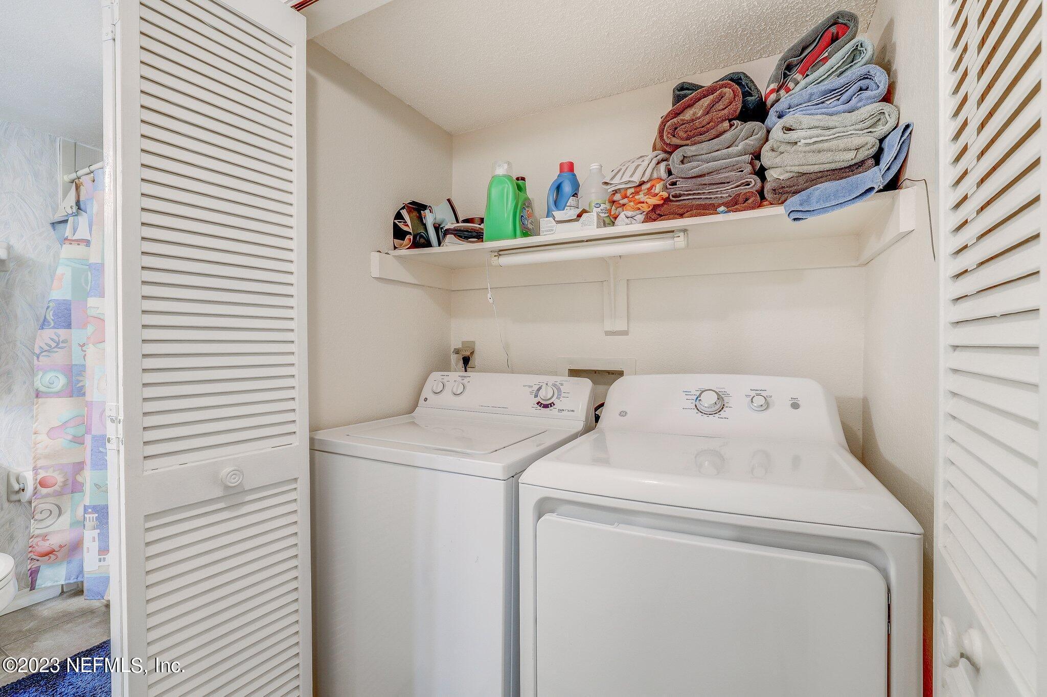 99 Broad River Place, Unit 1301 Welaka, FL 32193 - Photo 25 of 50 a utility room with dryer and washer
