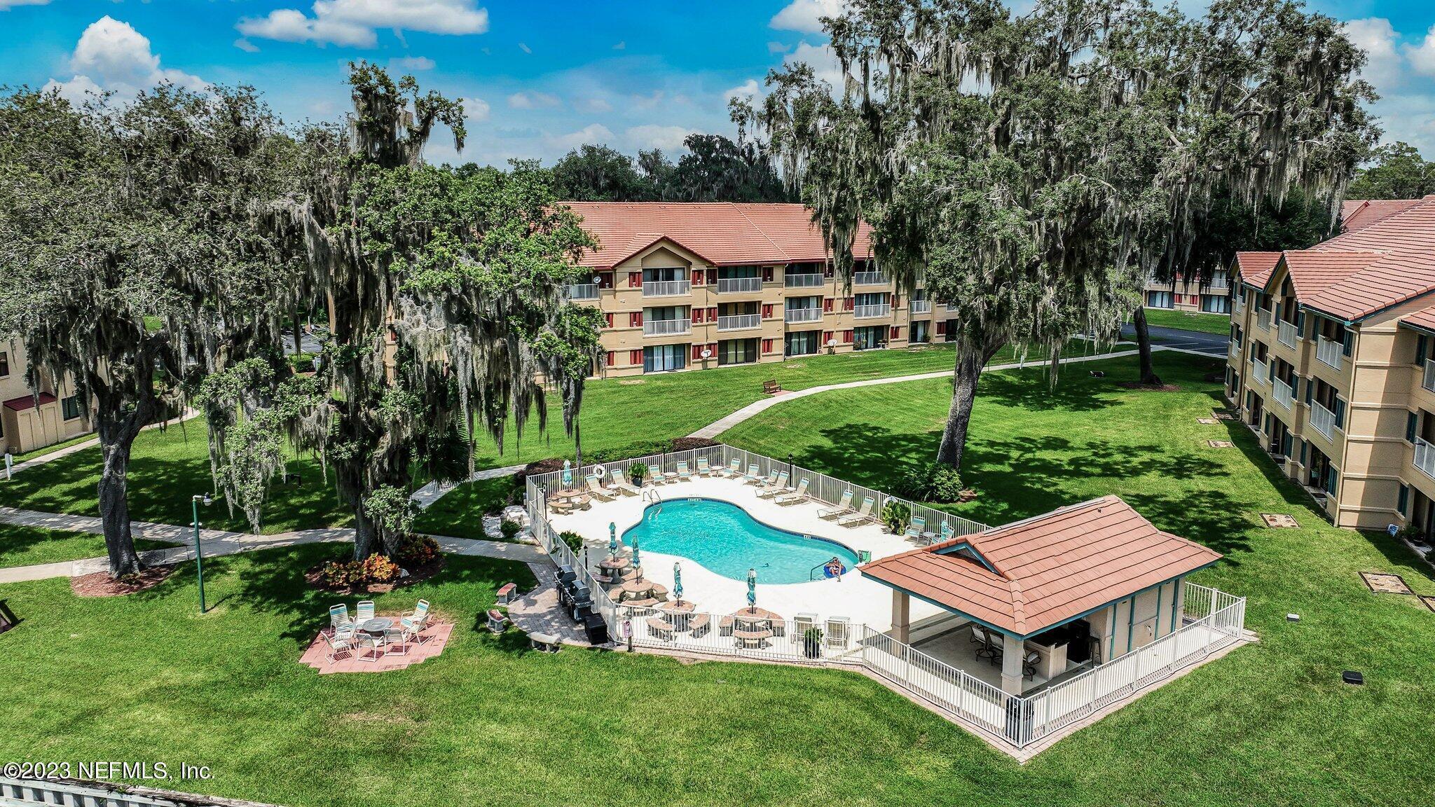 99 Broad River Place, Unit 1301 Welaka, FL 32193 - Photo 36 of 50 a aerial view of a house with a yard table and chairs