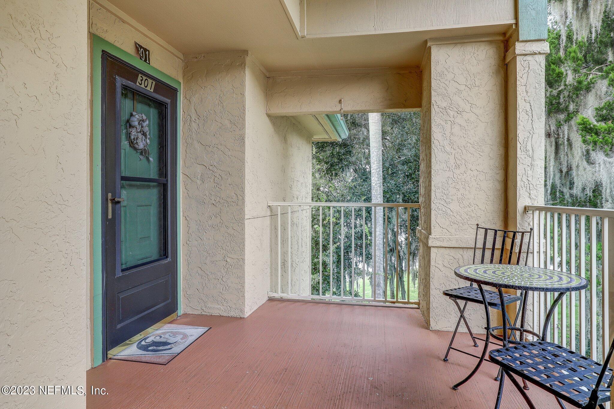 99 Broad River Place, Unit 1301 Welaka, FL 32193 - Photo 37 of 50 a view of a hallway with furniture and front door