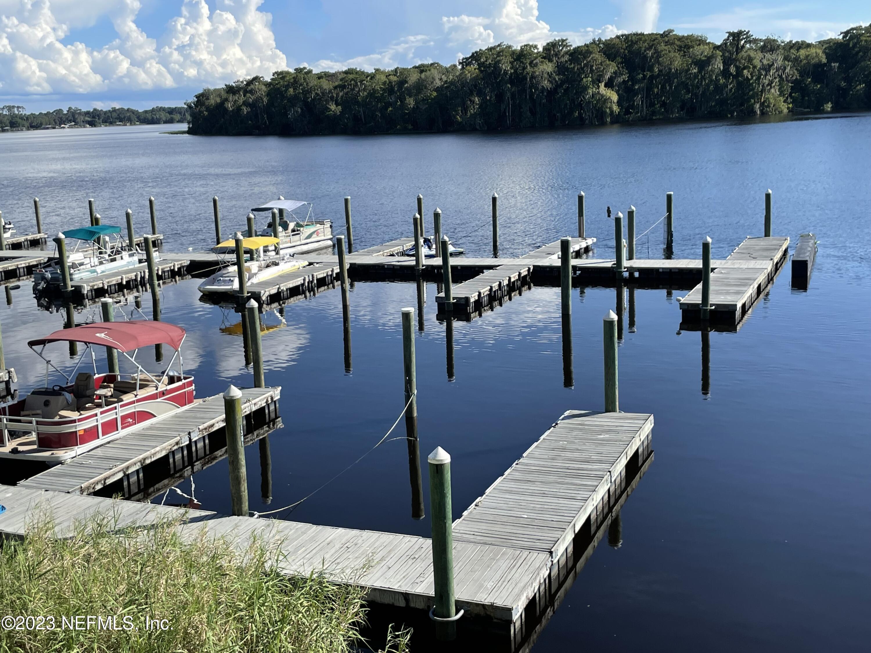 99 Broad River Place, Unit 1301 Welaka, FL 32193 - Photo 47 of 50 a view of a lake with sitting area