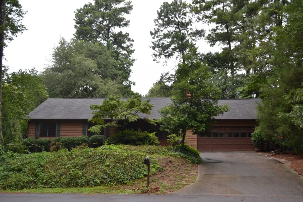 4461 Marjorie Road Southwest Snellville, GA 30039 - Photo 1 of 1 a front view of a house with a yard