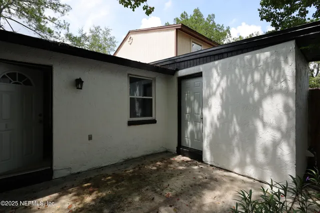 a house with a tree in front of it