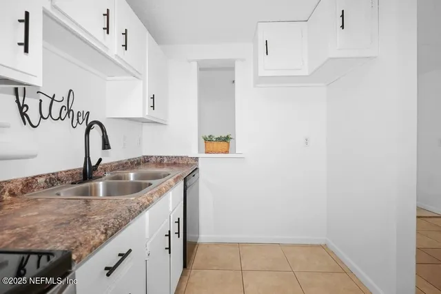 a kitchen with a sink and cabinets