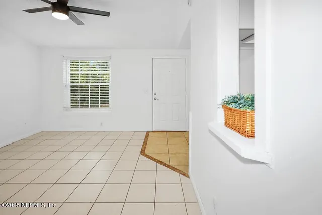 a view of an empty room and window