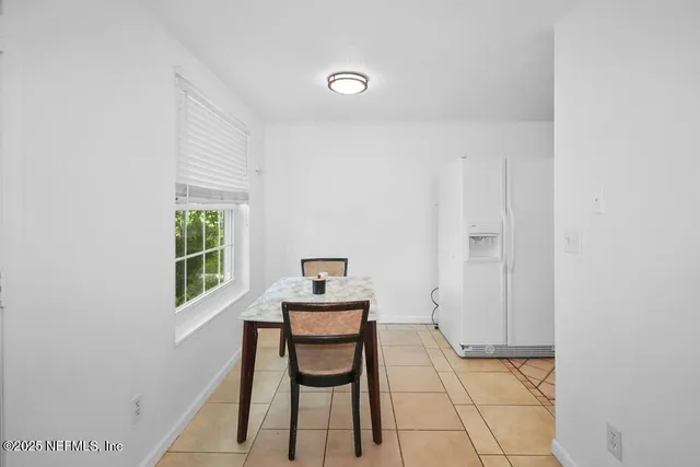 a view of a room with chairs and closet