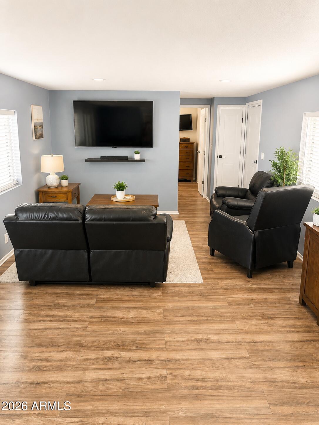 3330 East Main Street, Unit 332 Mesa, AZ 85213 - Photo 2 of 12 a living room with furniture and a flat screen tv