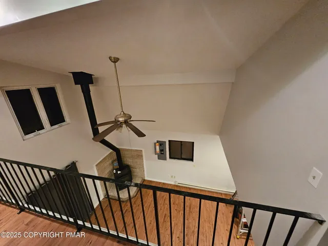 a view of a hallway with stairs