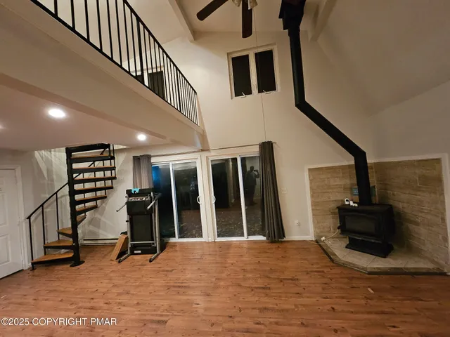 a view of an entryway with wooden floor