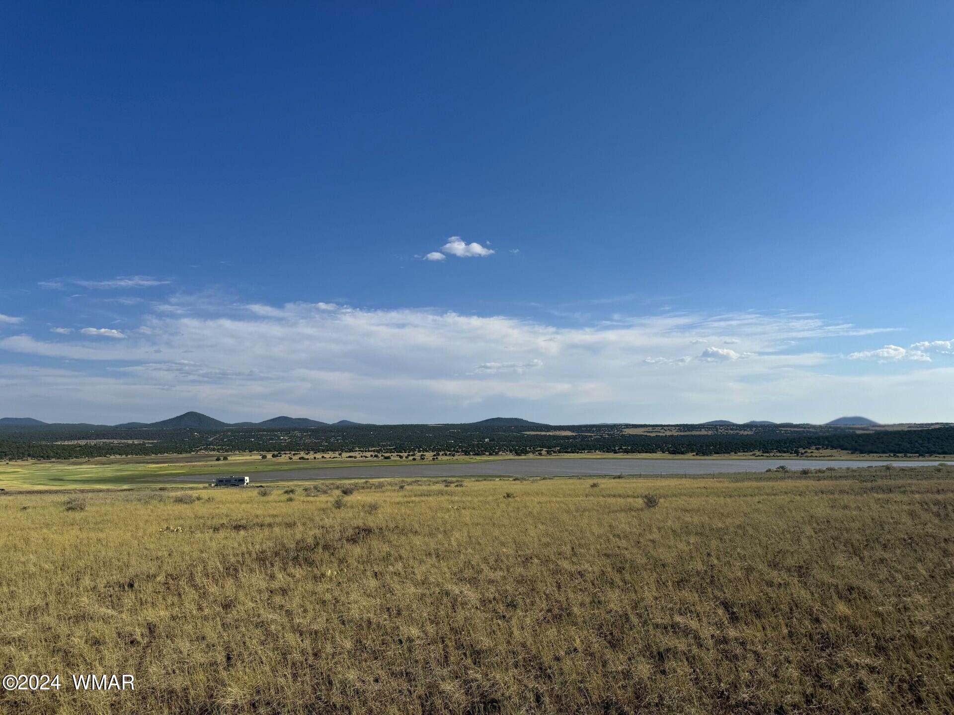 8147 North Concho, AZ 85924 - Photo 1 of 9 a view of an ocean and beach