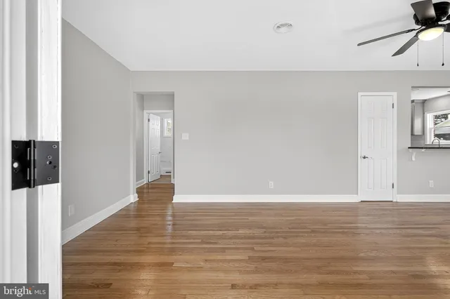a view of a room with wooden floor