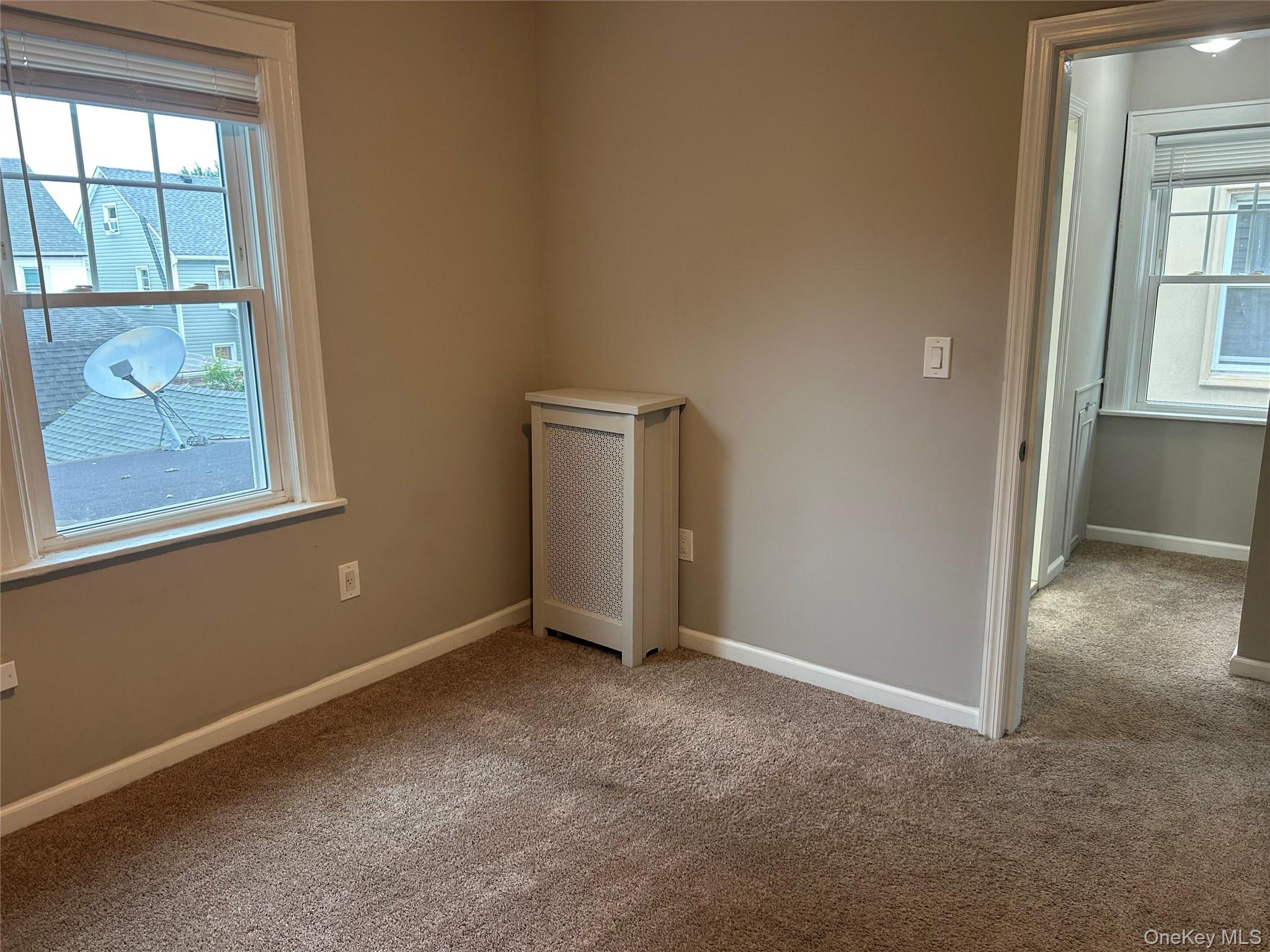 248-15 89th Avenue, Unit 2 Queens, NY 11426 - Photo 5 of 9 Spacious bedroom with ample natural light and good sized closet