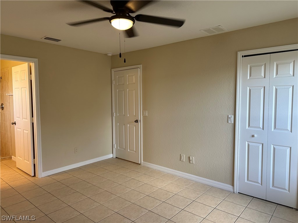 4106 24th Street Southwest Lehigh Acres, FL 33976 - Photo 12 of 15 a view of an empty room and window