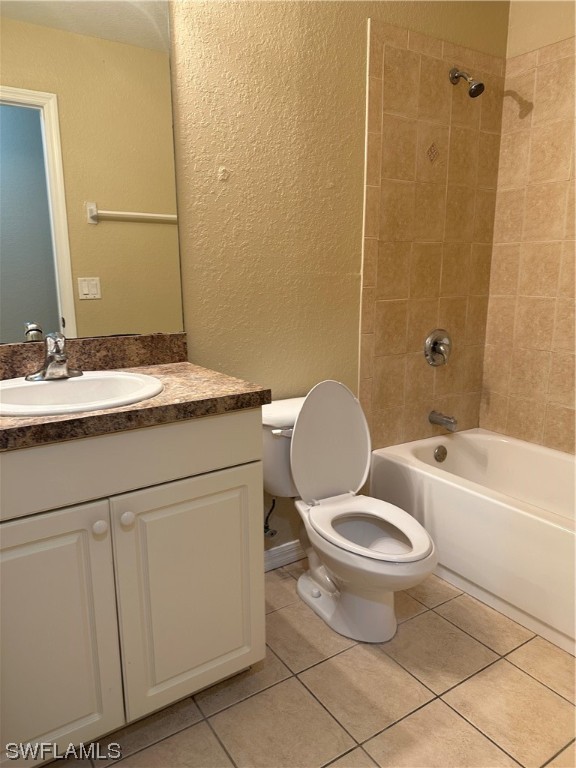 4106 24th Street Southwest Lehigh Acres, FL 33976 - Photo 9 of 15 a bathroom with a granite countertop toilet a sink and a mirror