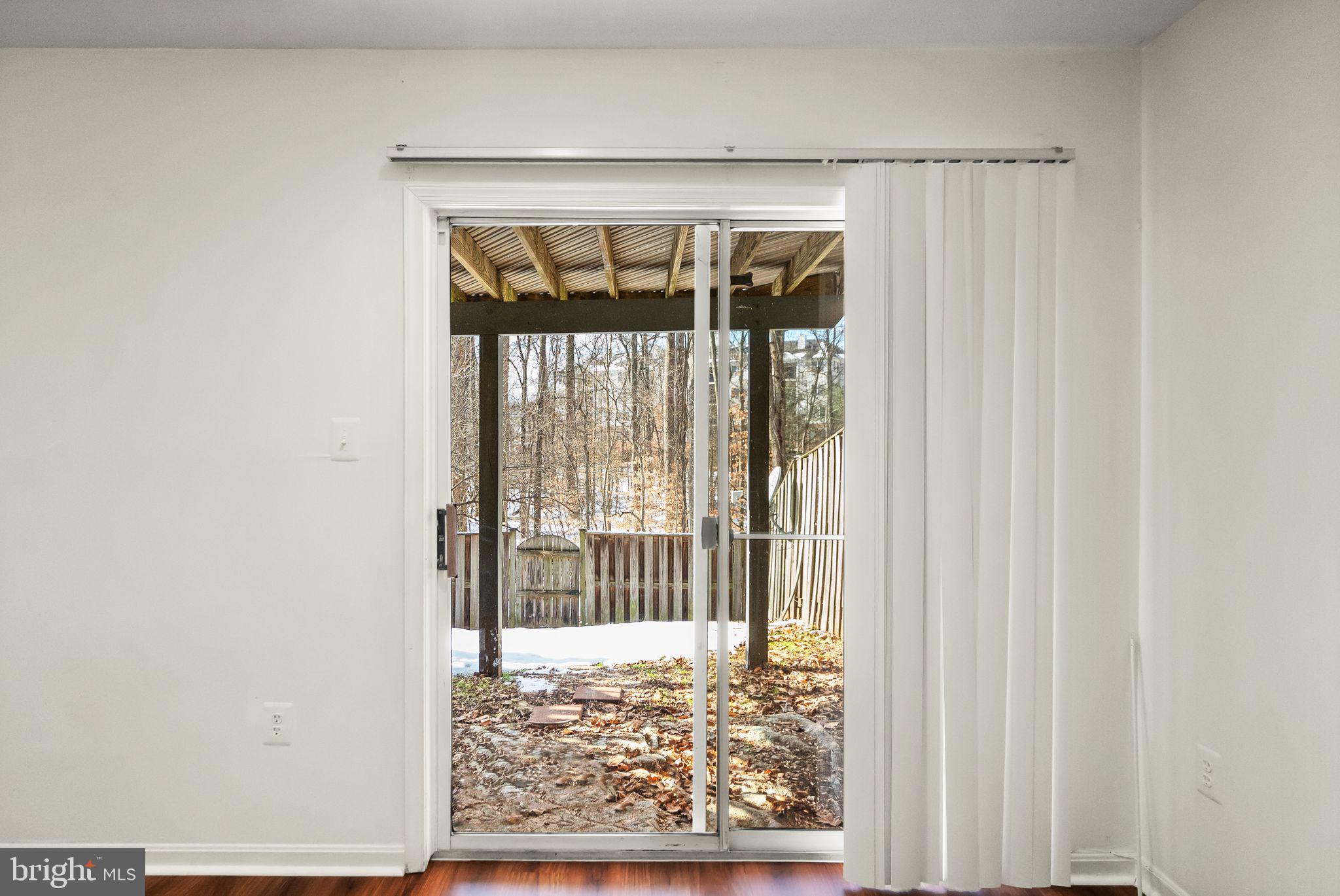47621 Comer Square Sterling, VA 20165 - Photo 65 of 81 SLIDING DOOR TO BACKYARD FROM BASEMENT