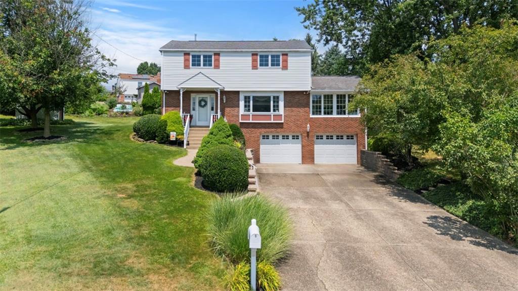 4 Cheryl Drive Coraopolis, PA 15108 - Photo 1 of 32 a front view of a house with a yard