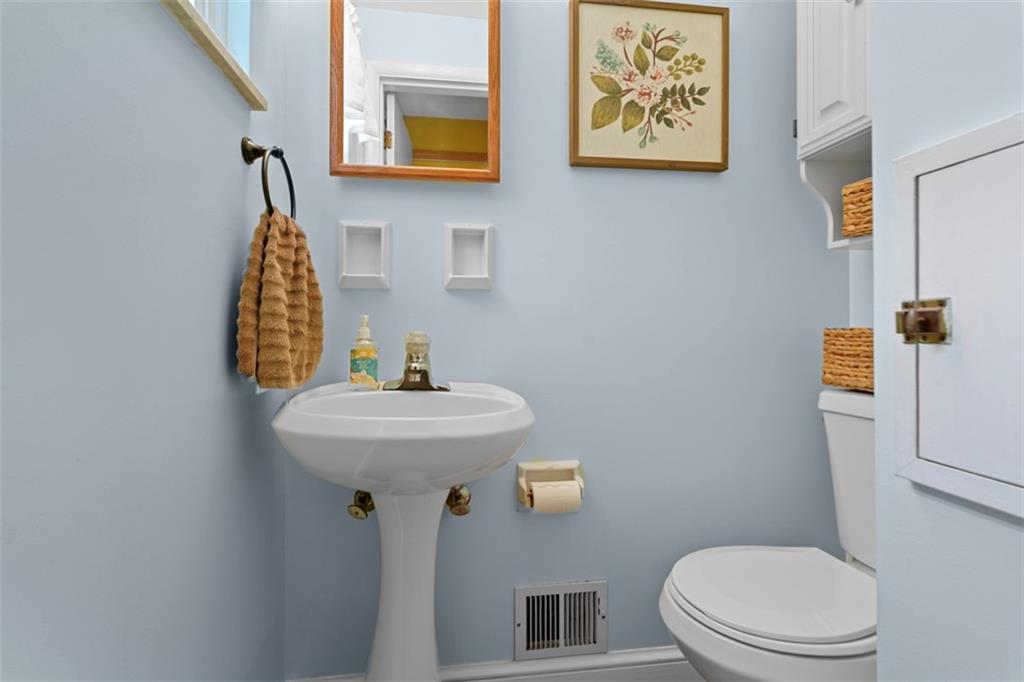 4 Cheryl Drive Coraopolis, PA 15108 - Photo 13 of 32 a bathroom with a sink a toilet and mirror