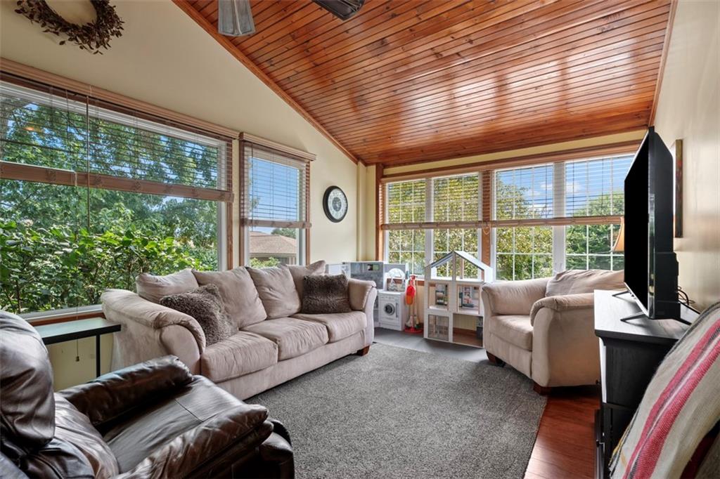 4 Cheryl Drive Coraopolis, PA 15108 - Photo 14 of 32 a living room with furniture tv and a large window