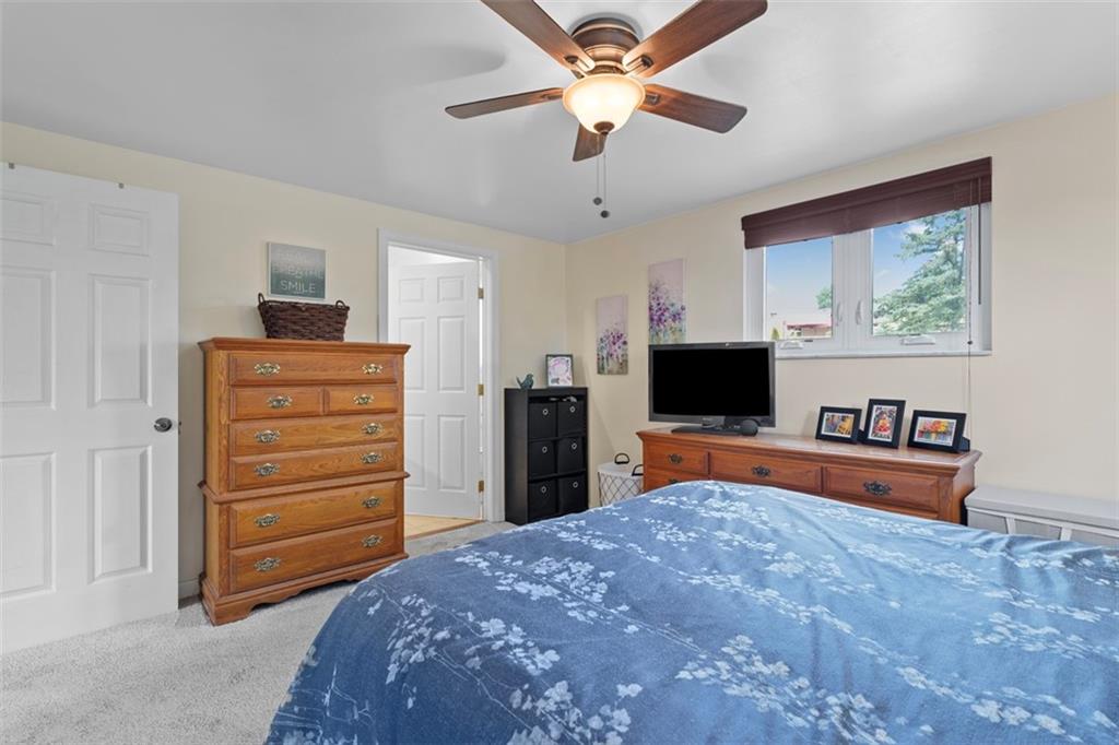 4 Cheryl Drive Coraopolis, PA 15108 - Photo 20 of 32 a bedroom with a bed and a television