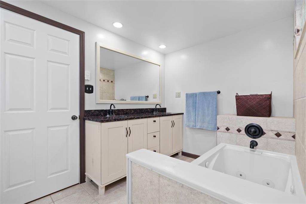 4 Cheryl Drive Coraopolis, PA 15108 - Photo 21 of 32 a bathroom with a sink and a mirror