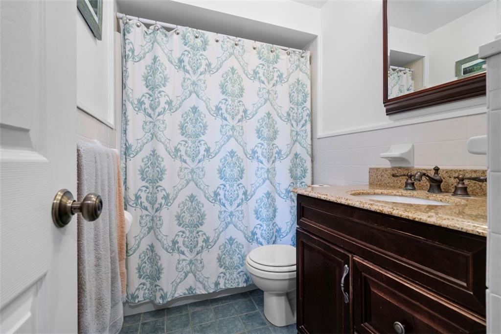 4 Cheryl Drive Coraopolis, PA 15108 - Photo 26 of 32 a bathroom with a granite countertop sink toilet and shower