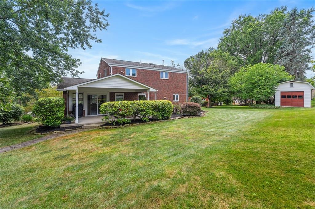4 Cheryl Drive Coraopolis, PA 15108 - Photo 31 of 32 a front view of a house with a yard