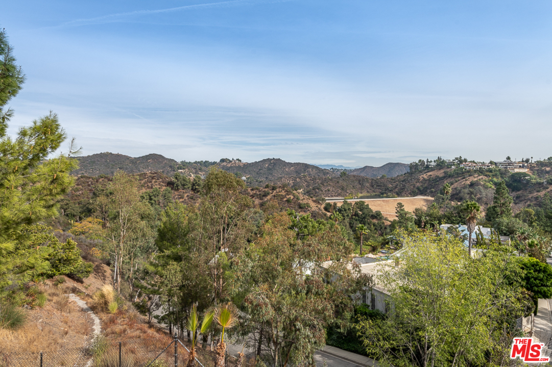 a view of a city with mountains in the background