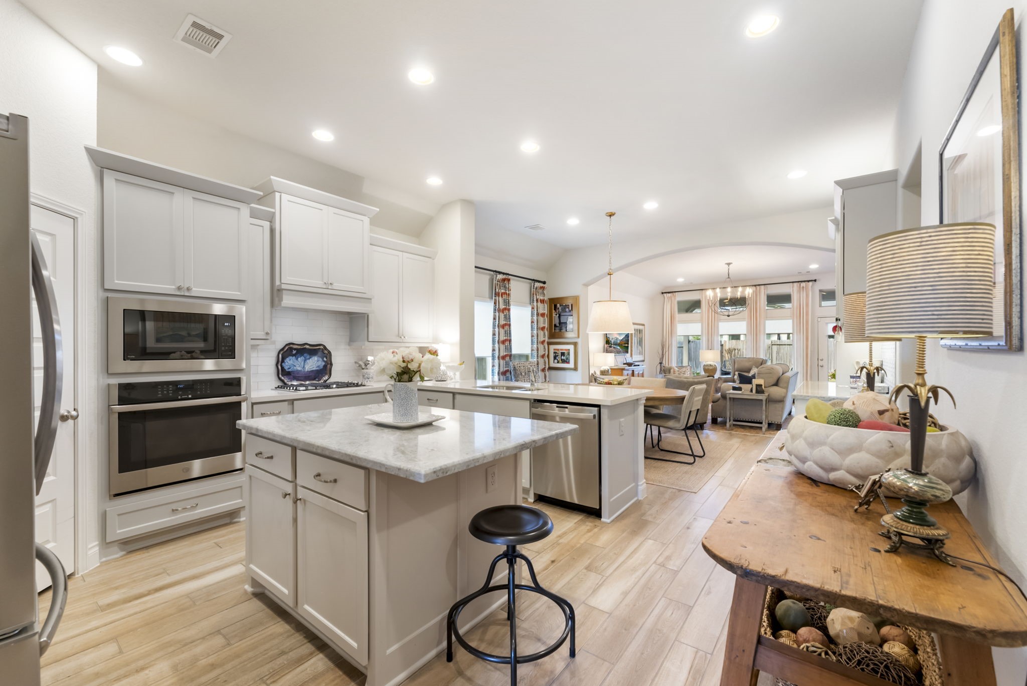 545 Cedar Harbor Court Conroe, TX 77304 - Photo 12 of 50 a kitchen with a sink cabinets and wooden floor
