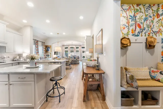 a kitchen with stainless steel appliances granite countertop a sink and cabinets