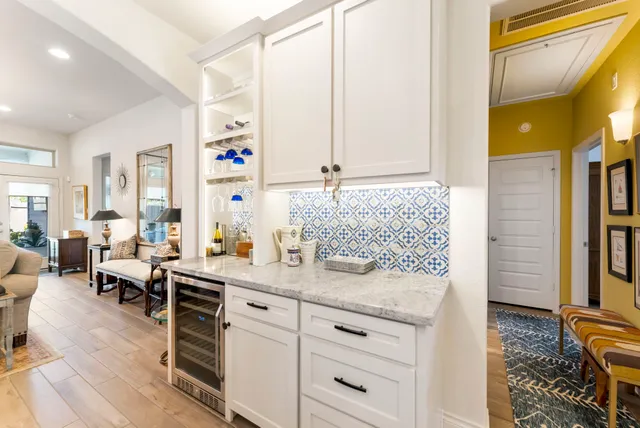 a spacious bathroom with a granite countertop sink and a mirror