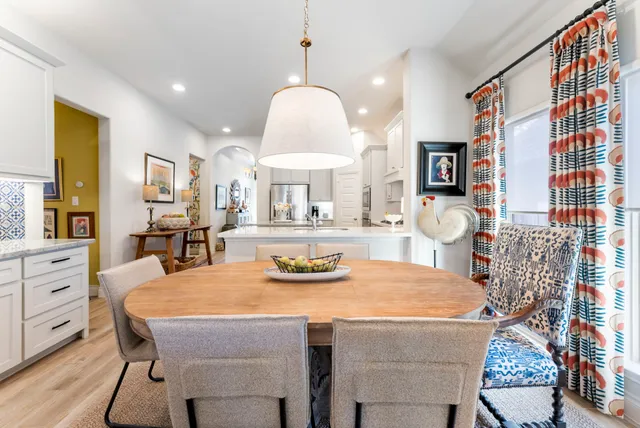 a dining room with furniture and window
