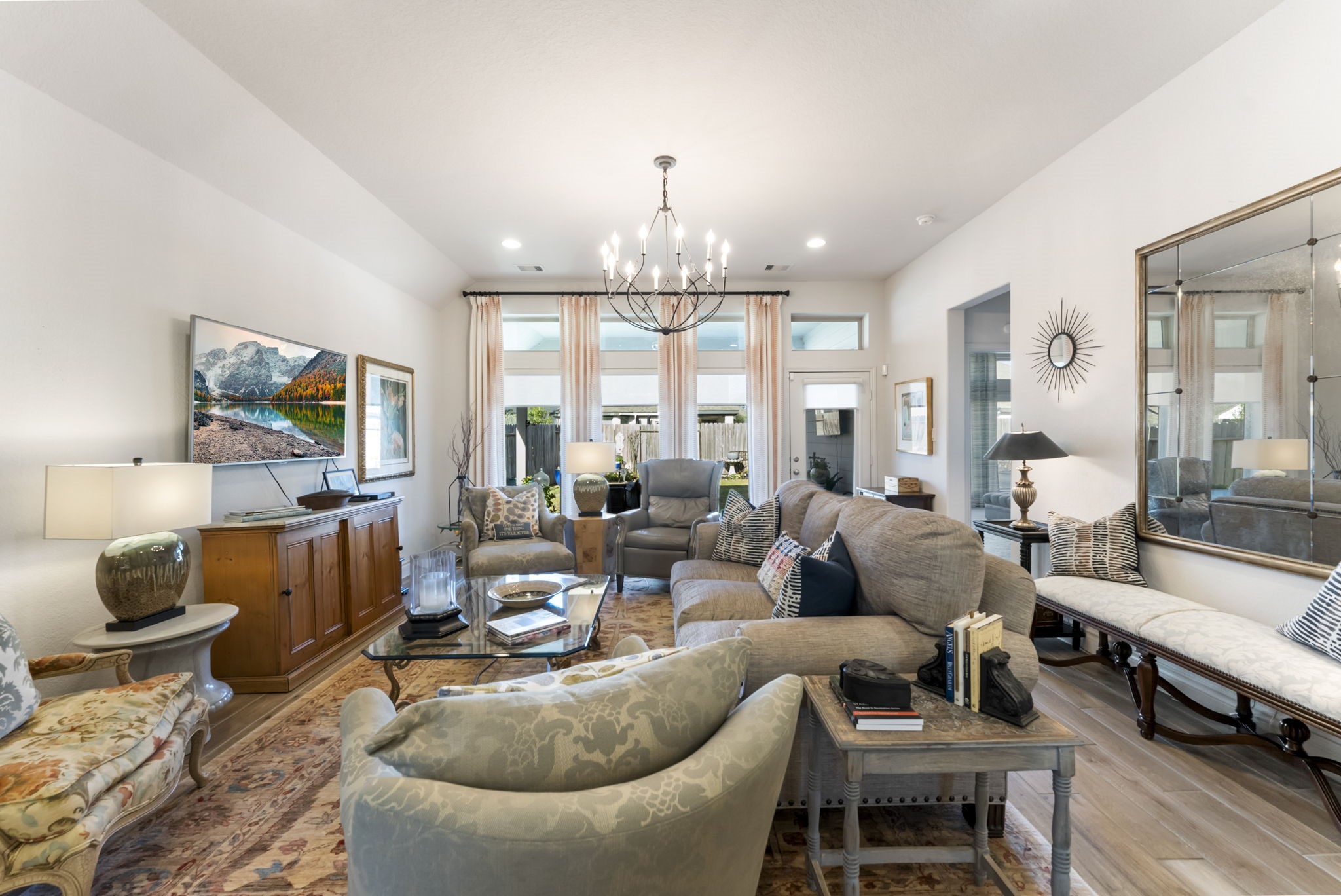 545 Cedar Harbor Court Conroe, TX 77304 - Photo 22 of 50 a living room with furniture and a chandelier