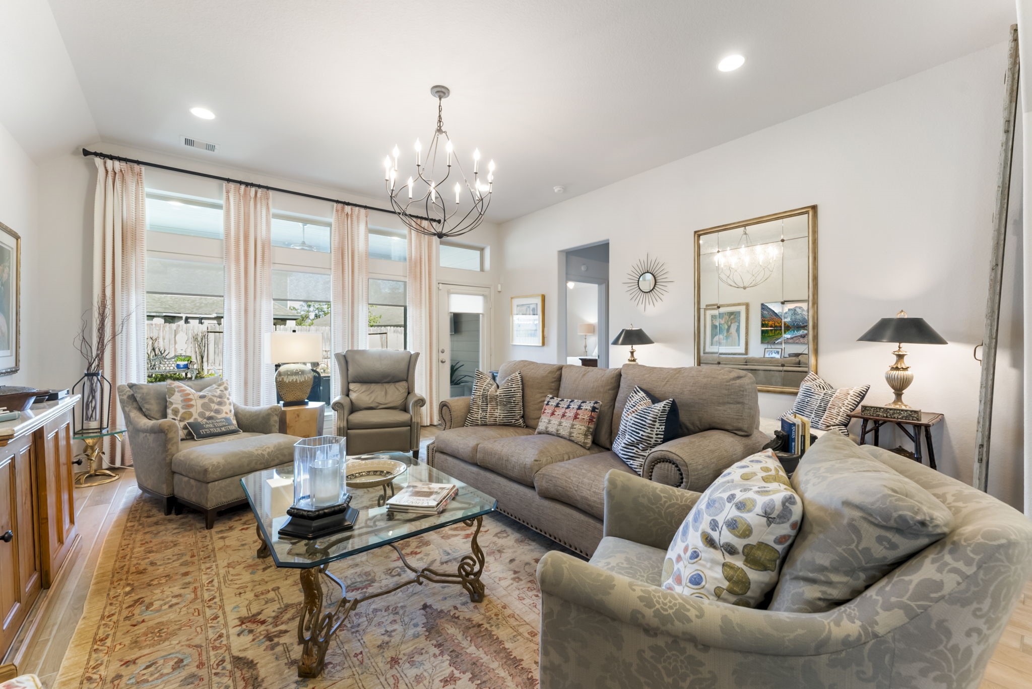 545 Cedar Harbor Court Conroe, TX 77304 - Photo 23 of 50 a living room with furniture chandelier and a large window