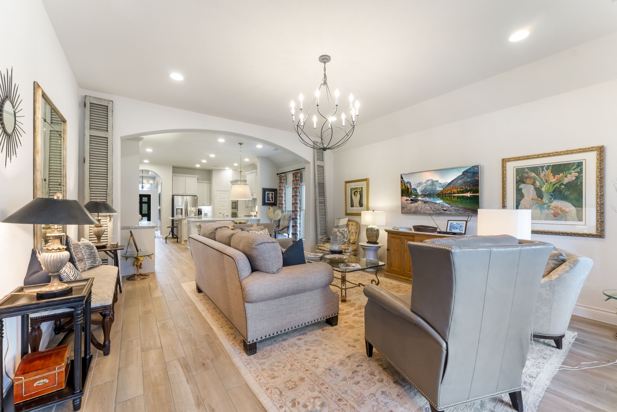 545 Cedar Harbor Court Conroe, TX 77304 - Photo 24 of 50 a living room with fireplace furniture and a chandelier