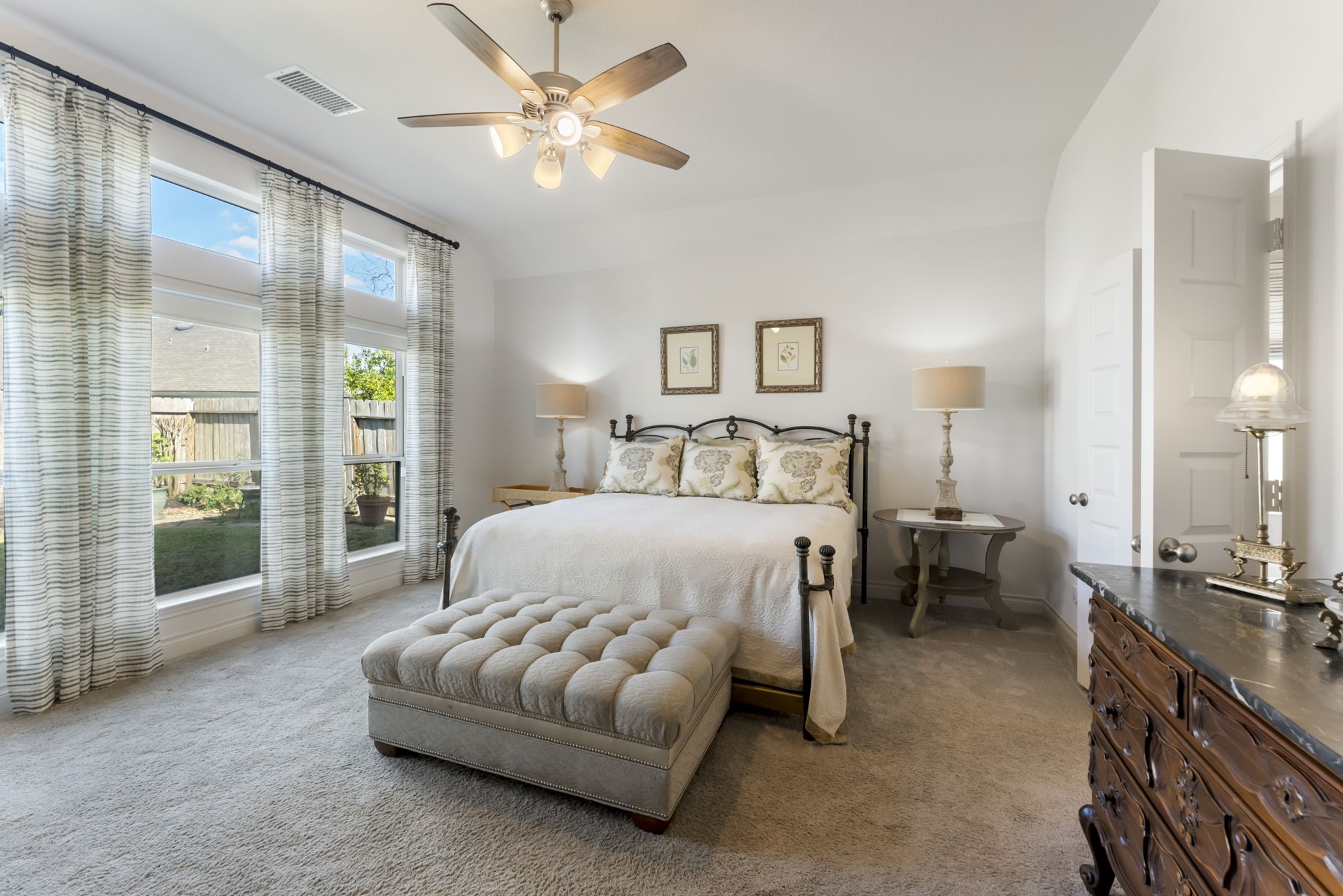 545 Cedar Harbor Court Conroe, TX 77304 - Photo 25 of 50 a bedroom with a bed mirror and a large window