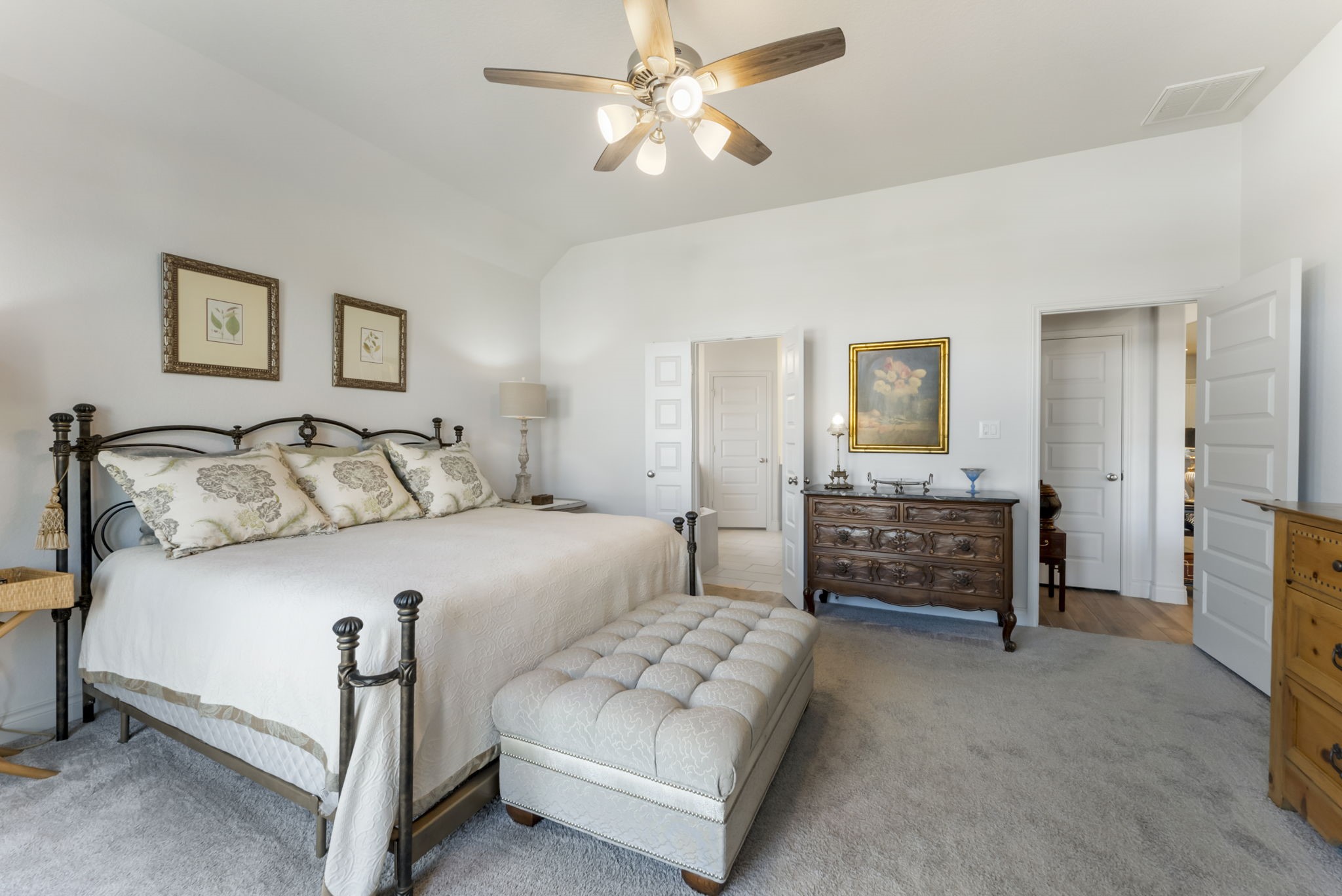 545 Cedar Harbor Court Conroe, TX 77304 - Photo 28 of 50 a bedroom with a bed and a chandelier