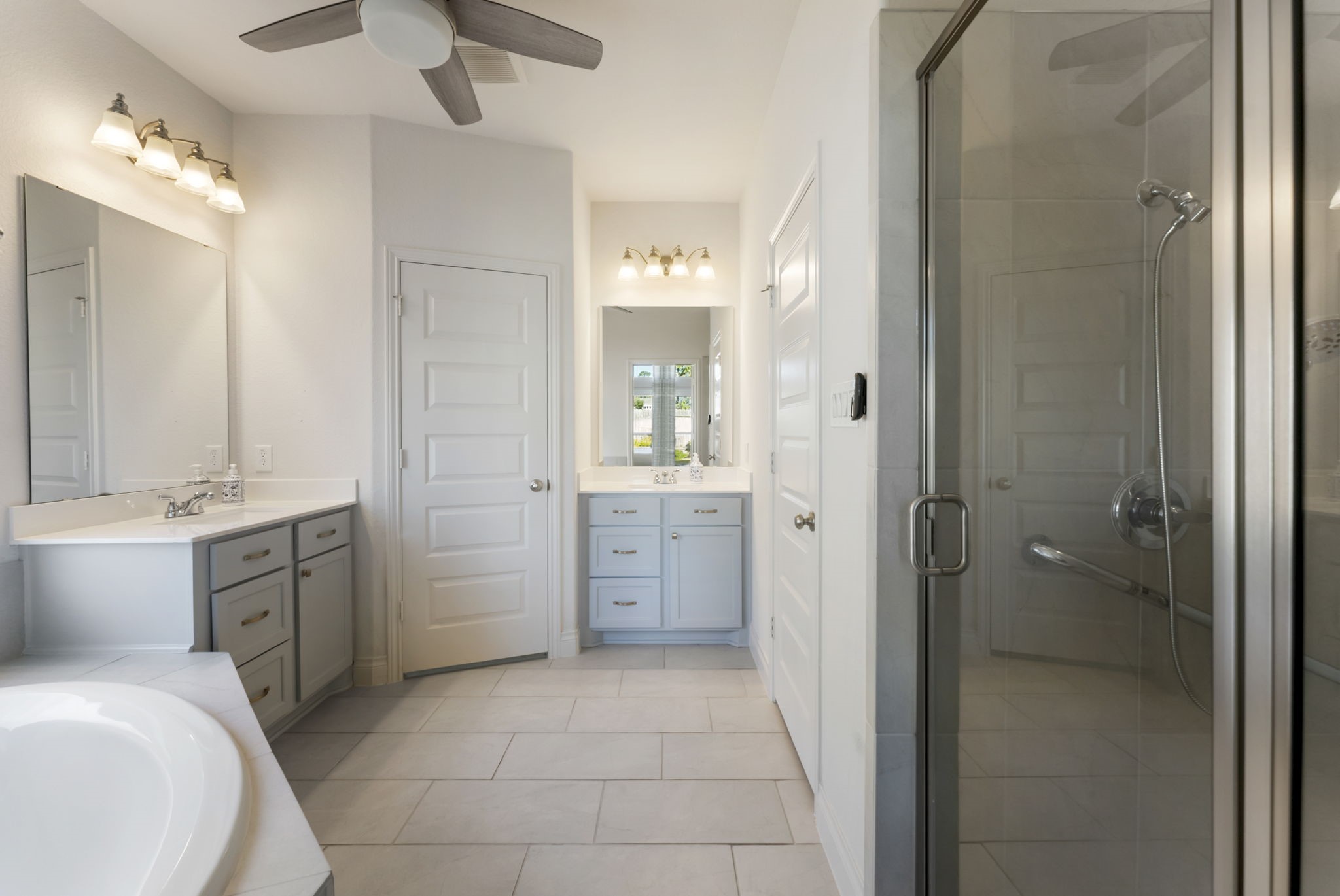 545 Cedar Harbor Court Conroe, TX 77304 - Photo 30 of 50 a bathroom with a granite countertop sink a toilet and shower