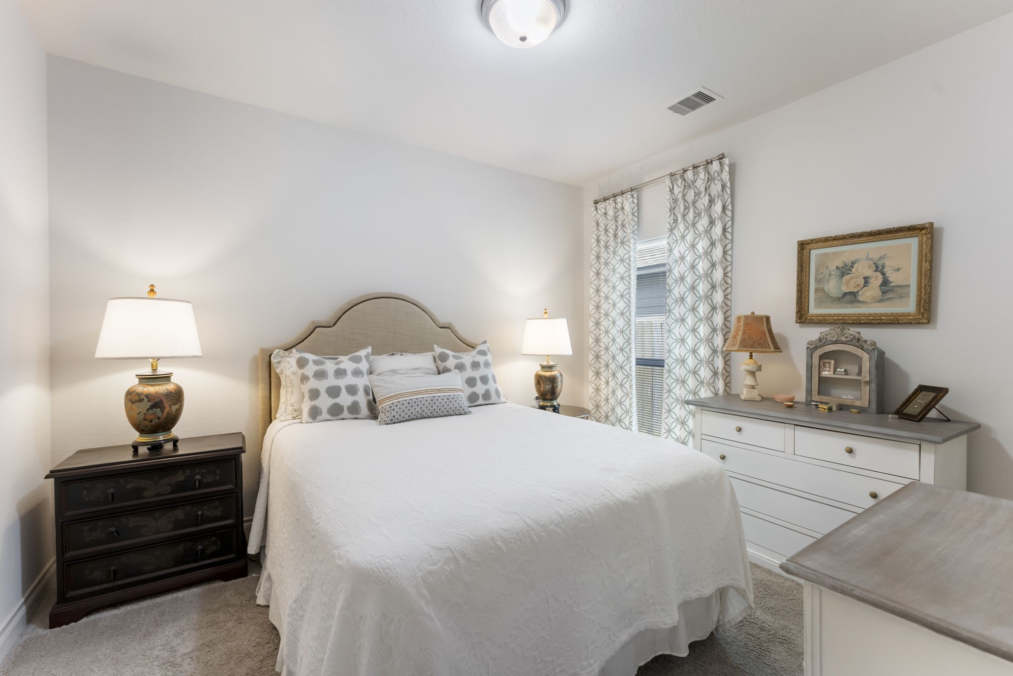 545 Cedar Harbor Court Conroe, TX 77304 - Photo 32 of 50 a bedroom with a bed and a lamp on dresser