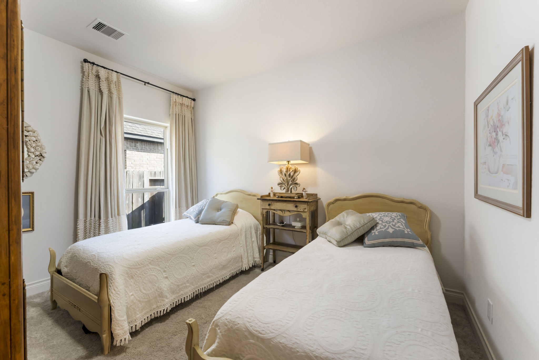 545 Cedar Harbor Court Conroe, TX 77304 - Photo 34 of 50 a bedroom with two beds and a window