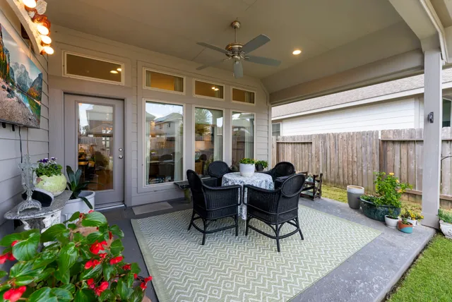 a work room with furniture and a potted plant