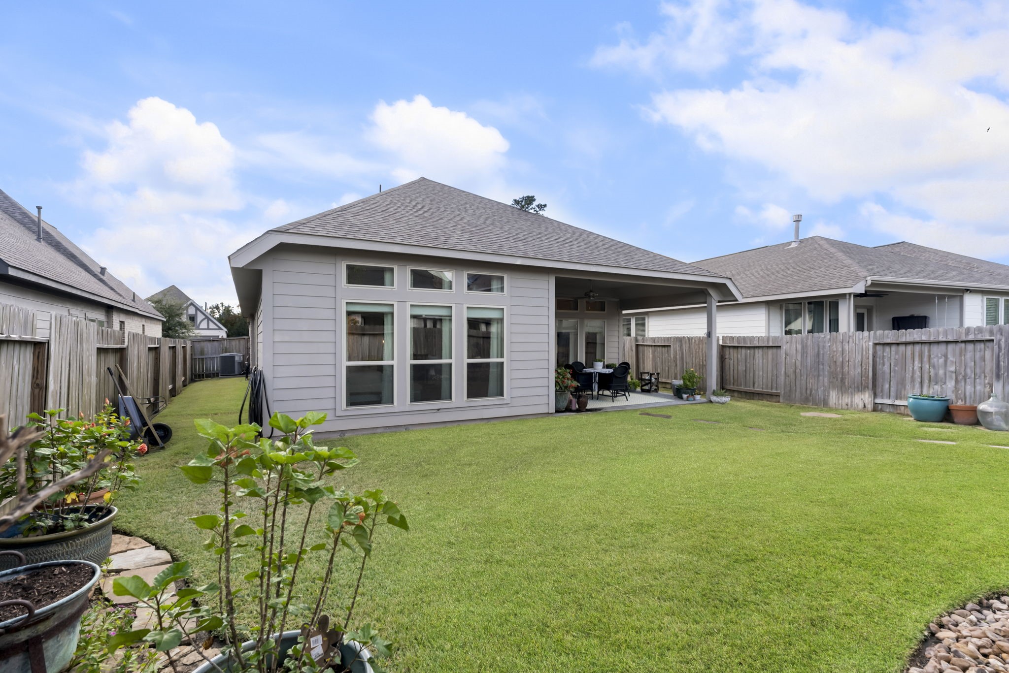545 Cedar Harbor Court Conroe, TX 77304 - Photo 38 of 50 a front view of a house with a garden