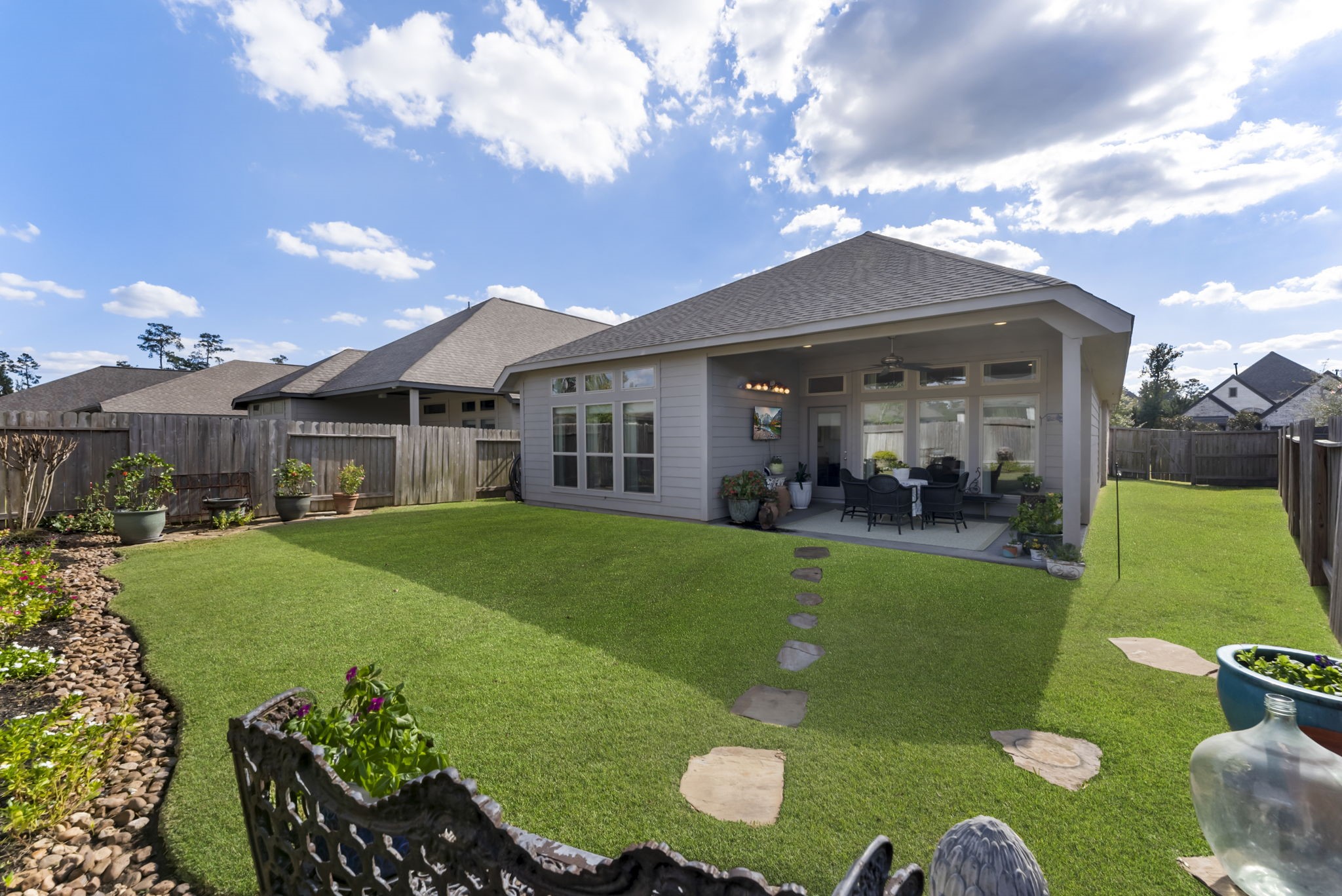 545 Cedar Harbor Court Conroe, TX 77304 - Photo 40 of 50 a view of an house with backyard space and garden