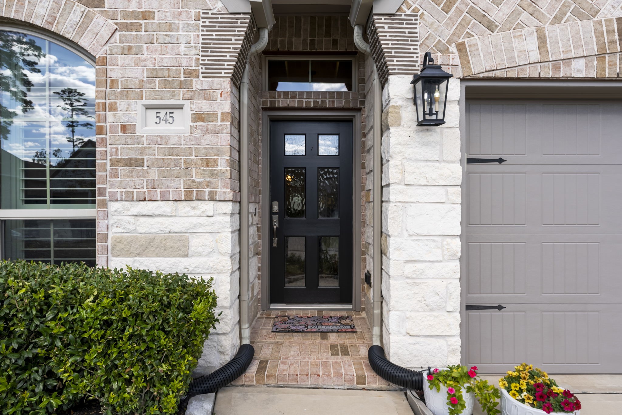 545 Cedar Harbor Court Conroe, TX 77304 - Photo 4 of 50 a front view of a house with a yard