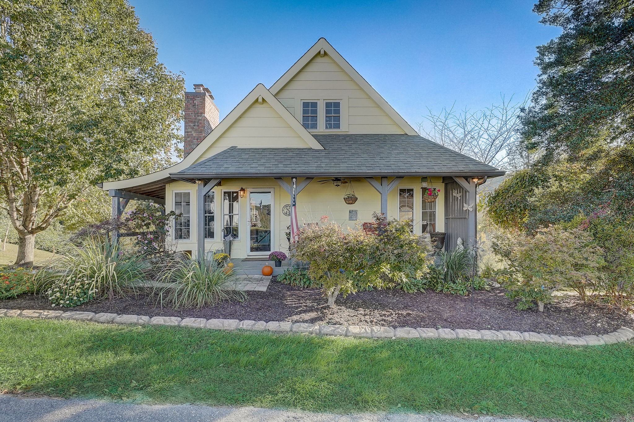 1677 Falling Water Road Sparta, TN 38583 - Photo 7 of 57 a front view of a house with garden