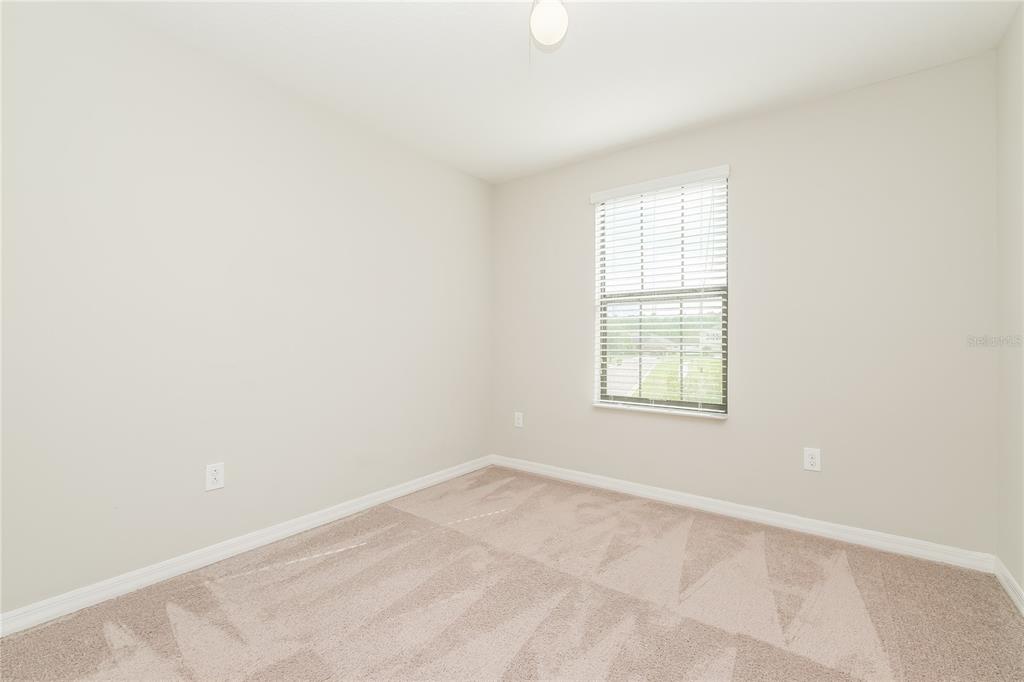 36125 Stable Wilk Avenue Zephyrhills, FL 33541 - Photo 12 of 17 an empty room with a window