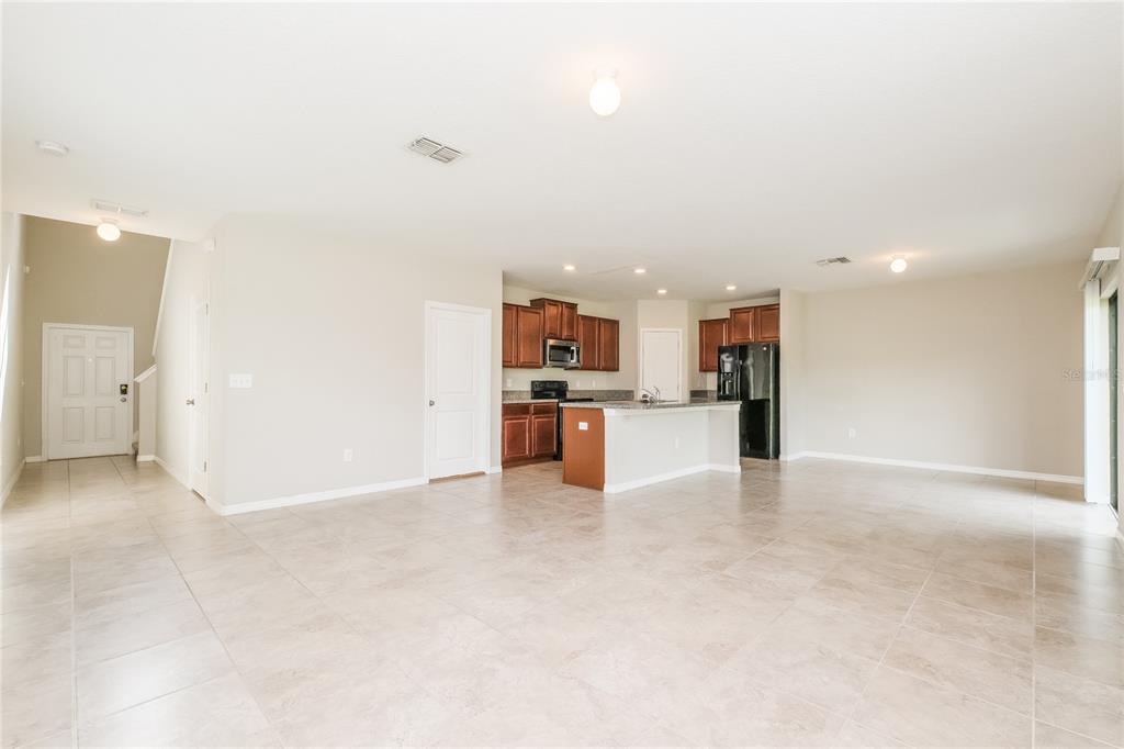 36125 Stable Wilk Avenue Zephyrhills, FL 33541 - Photo 2 of 17 a view of kitchen with kitchen island and stainless steel appliances