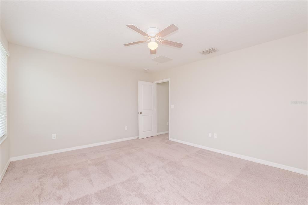 36125 Stable Wilk Avenue Zephyrhills, FL 33541 - Photo 7 of 17 a view of an empty room