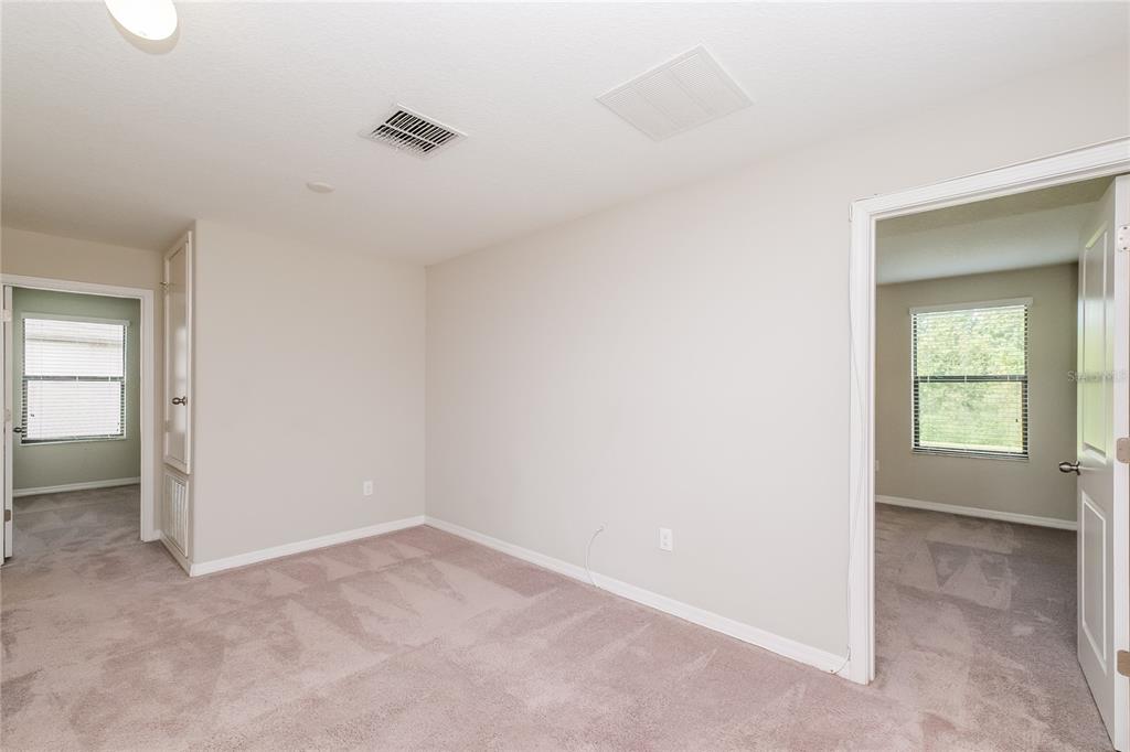 36125 Stable Wilk Avenue Zephyrhills, FL 33541 - Photo 9 of 17 an empty room with a window