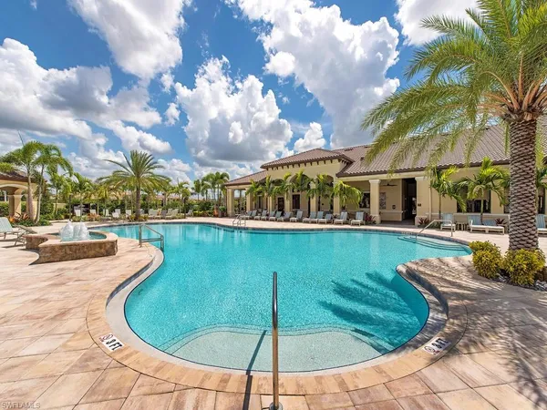 a view of a swimming pool with a patio