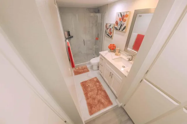 a bedroom with a bed couch and a dresser