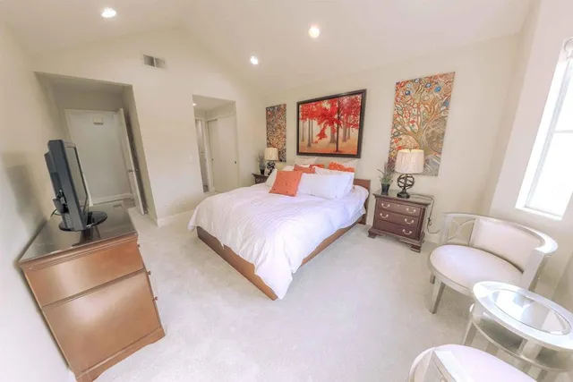 a bedroom with a bed and furniture